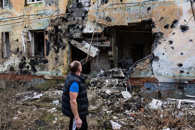 60-year-old, Andryi Pleshan, checks destruction around his shelter in the city of Izium, eastern Ukraine on January 2, 2023. Credit: Getty Images