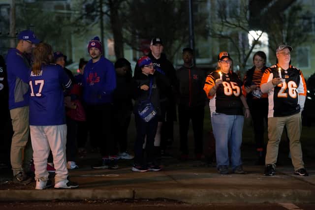 Fans gather for a vigil at the University of Cincinnati Medical Center for football player Damar Hamlin. (Getty Images) 