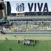 The coffin of Pele leaves Santos’ Vila Belmiro stadium. Credit: Wagner Meier/Getty Images