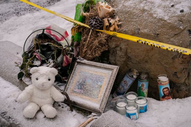 Objects left for a makeshift memorial sit at the site of a quadruple murder in Moscow, Idaho (Photo by David Ryder/Getty Images)