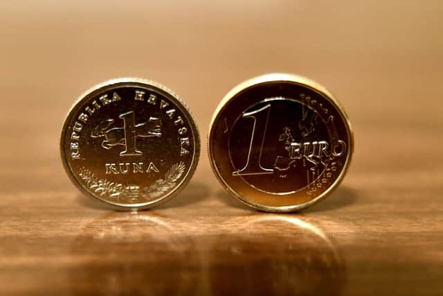 The Euro (right) is now Croatia’s official currency, after the country dropped the Kuna (left) (image: AFP/Getty Images)