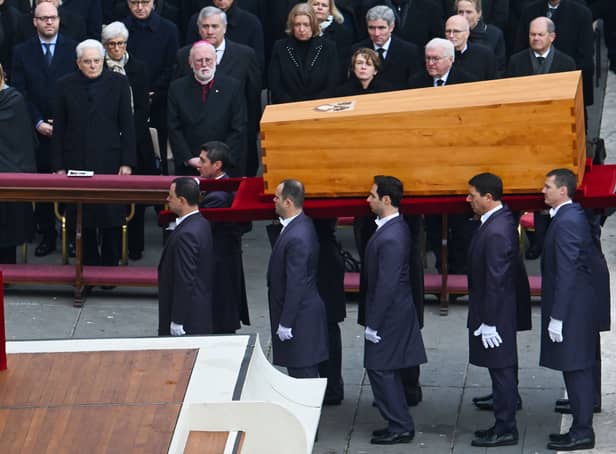 Pallbearers carry the coffin of Pope Emeritus Benedict XVI at the end of his funeral mass at St. Peter’s square in the Vatican (Photo: FILIPPO MONTEFORTE/AFP via Getty Images)
