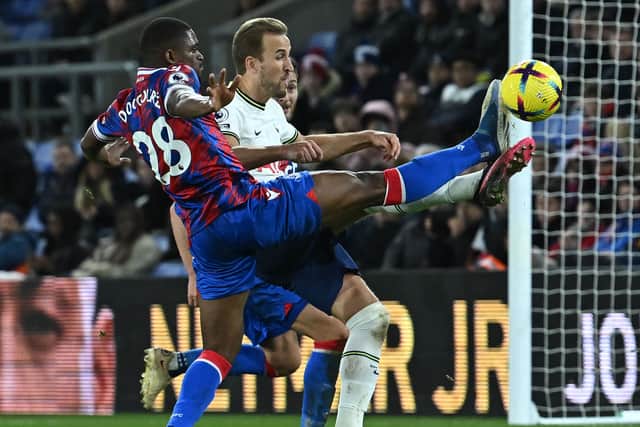 Crystal Palace’s Cheick Doucoure challenges Harry Kane