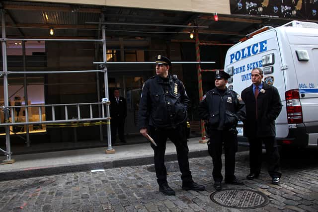Police stand at the scene on 158 Mercer St. where Mark Madoff, son of Bernard Madoff, was found dead on December 11, 2010 in New York City (Photo by Yana Paskova/Getty Images)