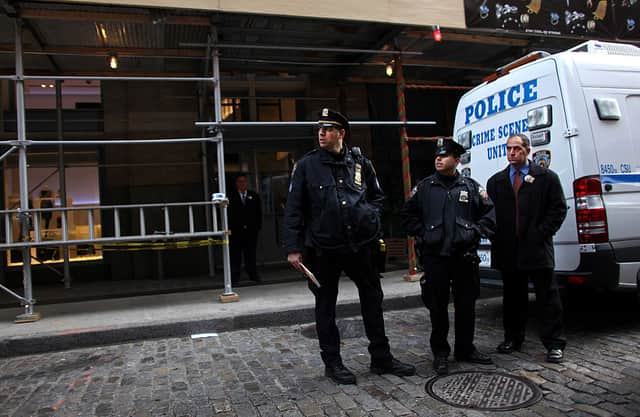 Police stand at the scene on 158 Mercer St. where Mark Madoff, son of Bernard Madoff, was found dead on December 11, 2010 in New York City (Photo by Yana Paskova/Getty Images)