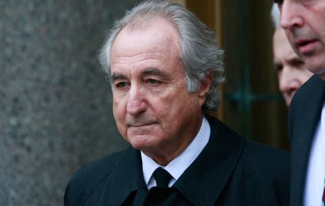 $50 billion Ponzi scheme swindler Bernard Madoff exits federal court March 10, 2009 in New York City (Photo by Mario Tama/Getty Images)