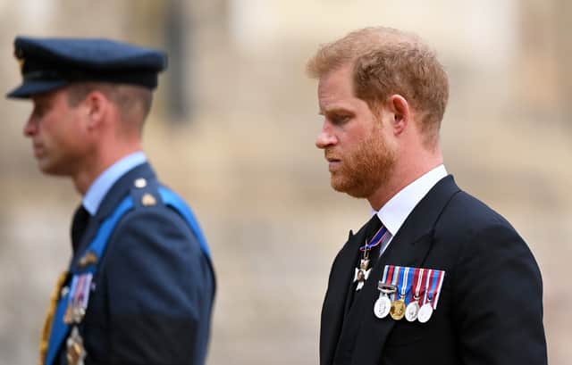 Prince William, Prince of Wales and Prince Harry, Duke of Sussex join the Procession following the State Hearse carrying the coffin of Queen Elizabeth II towards St George’s Chapel. (Photo by Justin Setterfield/Getty Images)
