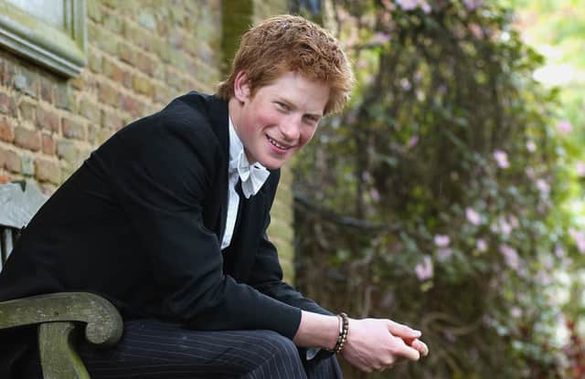 Prince Harry poses for photographs on May 12, 2003 at Eton College, Eton in England. (Photo by Kirsty Wigglesworth-Pool/Getty Images)