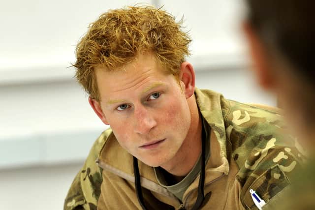 This picture taken on November 1, 2012 shows Britain’s Prince Harry at a mission briefing at the British controlled flight-line at Camp Bastion in Afghanistan’s Helmand Province, where he was serving as an Apache helicopter pilot/gunner with 662 Sqd Army Air Corps. Britain’s Prince Harry confirmed he killed Taliban fighters during his stint as a helicopter gunner in Afghanistan, it can be reported after he completed his tour of duty on January 21, 2013.  (Photo credit should read JOHN STILLWELL/AFP via Getty Images)