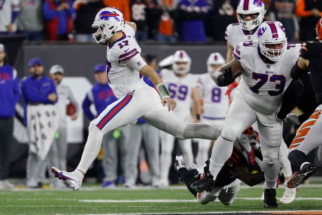 CINCINNATI, OHIO - JANUARY 02: Josh Allen #17 of the Buffalo Bills carries the ball against the Cincinnati Bengals during the first quarter at Paycor Stadium on January 02, 2023 in Cincinnati, Ohio. (Photo by Kirk Irwin/Getty Images)