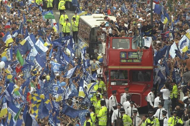 Chelsea Football Club parade through the streets of Chelsea in an open topped bus in front of their supporters to celebrate their 2-0 victory over Middlesbrough in the 1997 FA Cup Final.