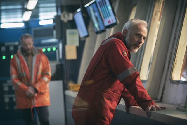 Mark Bonnar as Alwyn Evans, with Iain Glen as Magnus MacMillan slightly out of focus behind him (Credit: Amazon Prime Video)