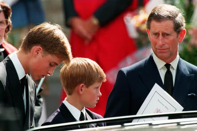 Former husband of Diana Prince Charles (L) and their two sons Harry (C) and William wait in front of the Westminster Abbey in London after the funeral ceremony of Princess of Wales (AFP via Getty Images)