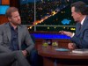 Prince Harry takes a swipe at the royals on Stephen Colbert's show with the help of Tom Hanks