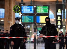 French police stand guard in a cordonned off area at Paris’ Gare du Nord train station. Credit: JULIEN DE ROSA/AFP via Getty Images