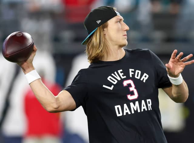 Trevor Lawrence #16 of the Jacksonville Jaguars warms up while wearing a shirt in support of Buffalo Bills safety Damar Hamlin prior to a game against the Tennessee Titans at TIAA Bank Field on January 07, 2023 in Jacksonville, Florida. Hamlin suffered cardiac arrest during the Bills’ Monday Night Football game against the Cincinnati Bengals and remains in intensive care. (Photo by Mike Carlson/Getty Images)