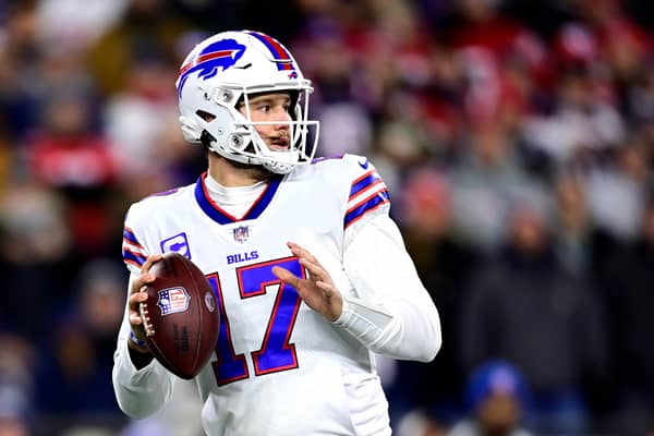 Quarterback Josh Allen #17 of the Buffalo Bills drops back to pass in the first quarter against the New England Patriots at Gillette Stadium on December 01, 2022 in Foxborough, Massachusetts. (Photo by Billie Weiss/Getty Images)