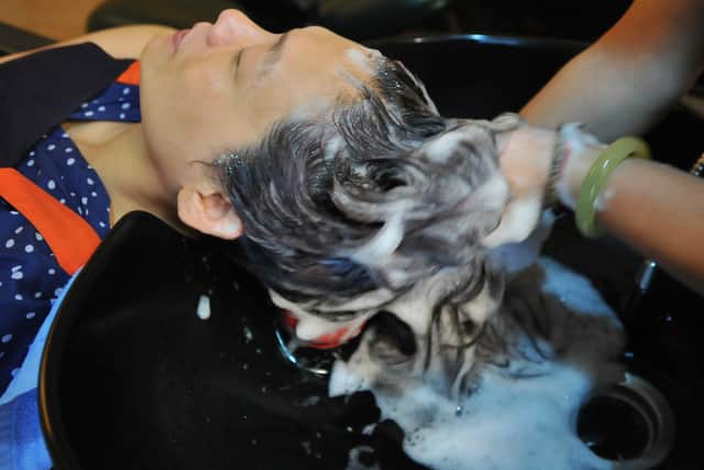 How often should you wash your hair?  (Photo credit should read Mandy Cheng/AFP via Getty Images)