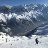 Alpine skiers ski down a piste at La Flegere ski resort as the Mont Blanc summit is seen in the distance Picture: Sean Gallup/Getty Images