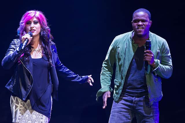 Jessica Meuse performs with C.J. Harris during the American Idol Live! 2014 Tour Kickoff at the Broome County Arena on July  24, 2014 in Binghamton, New York.  (Photo by Brett Carlsen/Getty Images)