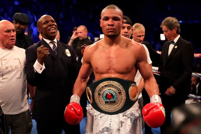 Eubank Jr celebrates victory over James DeGale with father Chris in February 2023