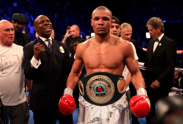 Eubank Jr celebrates victory over James DeGale with father Chris in February 2023