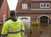Environment Agency staff check on the rising floodwaters in East Cowick, northern England on March 1, 2020 after Storm Jorge brought more rain and flooding to parts of the UK