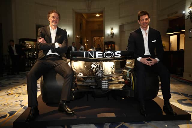 Sir Jim Ratcliffe (L) and Toto Wolff, Team Principal & CEO of The Mercedes AMG-PETRONAS F1 Team (R) pose with a Mercedes F1 car (Photo by Bryn Lennon/Getty Images)