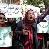 Members of Afghanistan’s Powerful Women Movement, take part in a protest in Kabul, chanting “burqa is not my hijab” after the Taliban’s order for women to cover fully in public. Credit: Getty Images