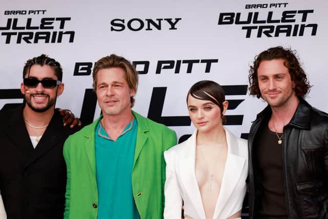 (L-R) Puerto Rican rapper-actor Bad Bunny, US actor Brad Pitt, US actress Joey King and English actor Aaron Taylor-Johnson attend the Los Angeles premiere of “Bullet Train” at the Regency Village theatre in Westwood, California, August 1, 2022. (Photo by MICHAEL TRAN/AFP via Getty Images)