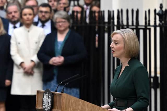 Outgoing Prime Minister Liz Truss stands at a lectern as she delivers her final speech outside 10 Downing Street in central London, before heading to Buckingham Palace to give her resignation, on October 25, 2022 (Photo by JUSTIN TALLIS/AFP via Getty Images)
