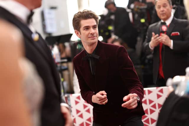 Andrew Garfield wore a burgundy YSL suit to The Oscars 2022.  (Photo by Emma McIntyre/Getty Images)