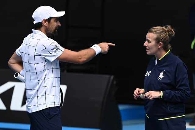 An enraged Chardy speaks to chair umpire Miriam Bley
