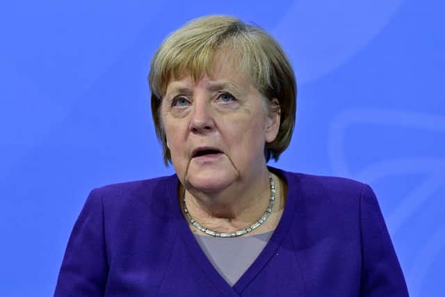 German Chancellor Angela Merkel attends a press conference after a video conference with German State Premiers about the current coronavirus situation, at the Chancellery on 2nd December, 2021 in Berlin, Germany.(Photo Filip Singer - Pool/Getty Images)