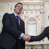 Russia’s President Vladimir Putin (R) welcomes Aleksandar Vučić (L) during a meeting in 2014 (Photo: MAXIM SHIPENKOV/POOL/AFP via Getty Images)