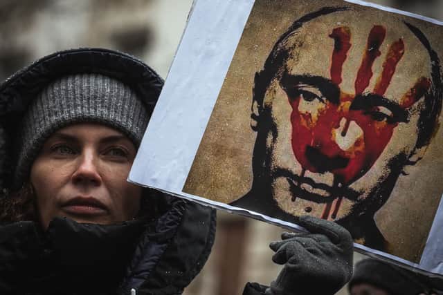 A protester holds a placard depicting Russian President Vladimir Putin during a demonstration against Russia’s military invasion of Ukraine, in Belgrade, in March 2022 (Photo: ANDREJ ISAKOVIC/AFP via Getty Images)