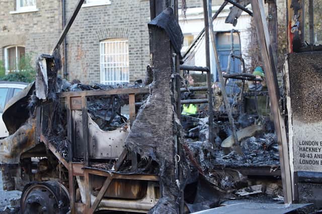 The burnt out remains of a 30-seater bus that was damaged by fire, along with six other vehicles and surrounding properties, on Wilton Way in Hackney, east London. Picture date: Friday January 20, 2023.