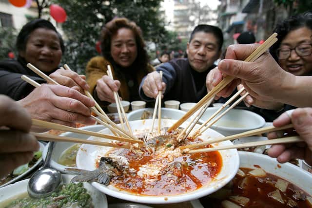 Residents dine on a feast to celebrate Chinese New Year (Photo: China Photos/Getty Images)