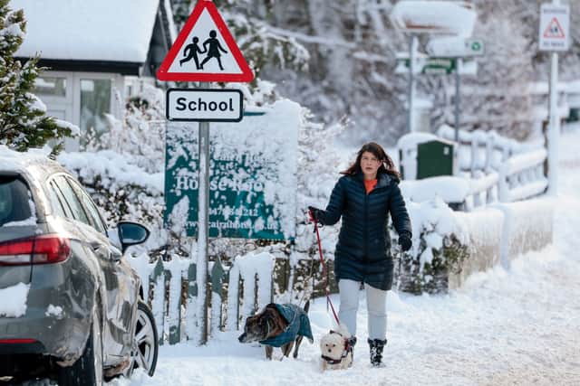 A member of the public makes their way through the snow on 18 January 2023 in Carrbridge, United Kingdom (Photo: Jeff J Mitchell/Getty Images)