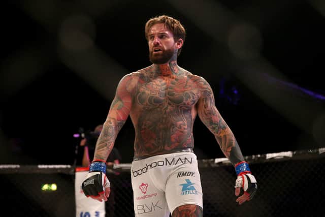 Aaron Chalmers celebrates a BAMMA 31 event victory in 2017