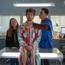 Máiréad Tyers as Jen, Luke Rollason as Jizzlord The Human, and John MacMillan as Dr Wedderburn in Extraordinary, examining Jizzlord (Credit: Laura Radford/Disney+)