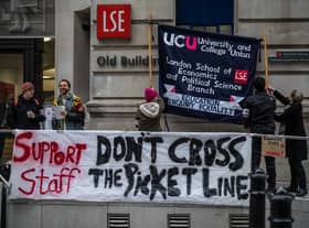 Striking university staff stand at a picket line outside London School of Economics on November 30, 2022 in London, United Kingdom. University staff across the UK are striking over pay, working conditions and pensions