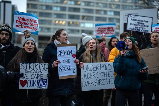 NHS physiotherapists take part in a strike outside of St Thomas' Hospital on January 26, 2023 in London