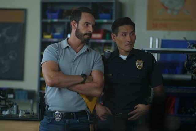 Rodrigo Santoro as Garrett Briggs and  Lanny Joon as Officer Jason Jang in Wolf Pack (Credit: Curtis Bonds Baker/Paramount+)