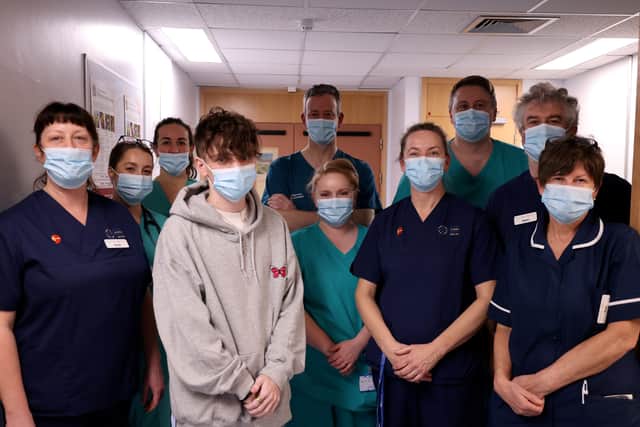 Jack (centre, grey hoodie) with members of the Intensive Care Team at Ysbyty Gwynedd (Photo: BCUHB / SWNS)