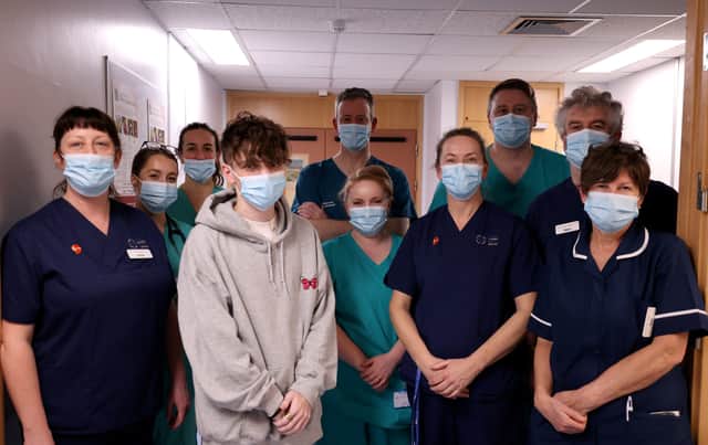 Jack (centre, grey hoodie) with members of the Intensive Care Team at Ysbyty Gwynedd (Photo: BCUHB / SWNS)
