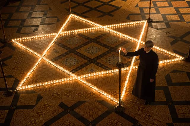 Millions of people across the word reflect on Holocaust Memorial Day each year. (Credit: Getty Images)