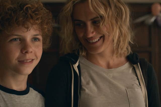 Colin O’Brien as Edward and Taylor Schilling as Aunt Lacey in Dear Edward (Credit: Apple TV+)