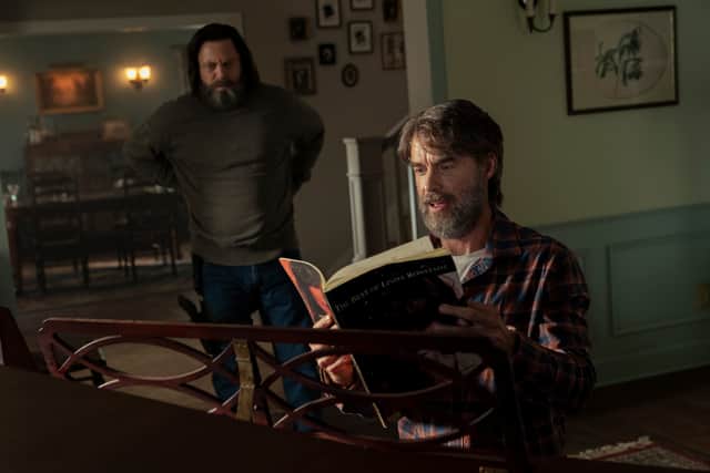 Nick Offerman as Bill and Murray Bartlett as Frank in The Last of Us, reading sheet music at a piano (Credit: HBO)