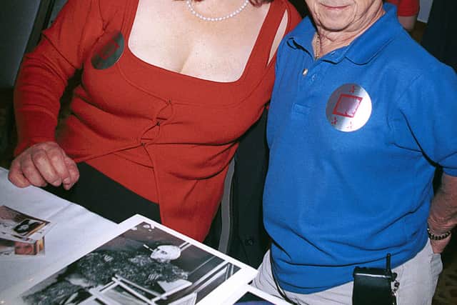 Actors Lisa Loring (Wednesday) and Felix Silla (Cousin Itt) from the mid-60’s television series “The Addams Family” attend the “Hollywood Collectors and Celebrities Show” April 7, 2001 in North Hollywood, CA. (Photo by Newsmakers)